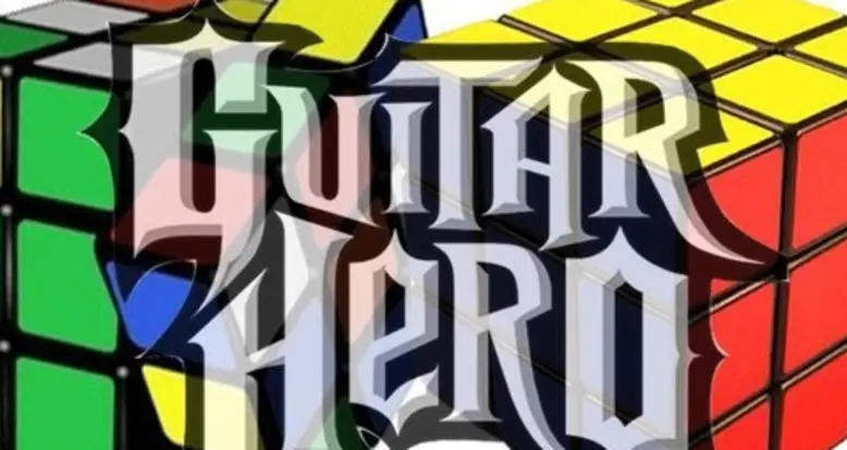 Solving 2 Rubik’s Cubes While Playing Guitar Hero