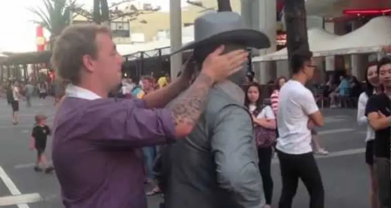 Street Performer Punches Obnoxious Guy
