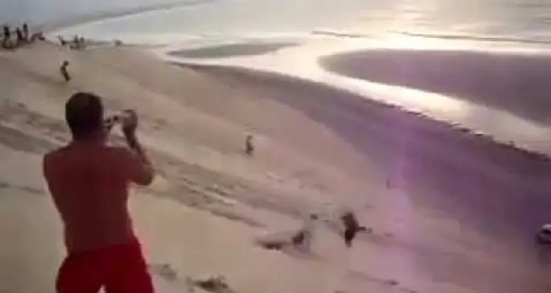 Ridiculous Backflips Down A Beach Hill