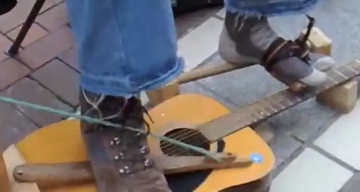 Man Plays Guitar With His Feet