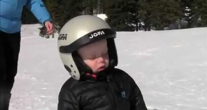 Kid Falls Asleep Standing On Skis